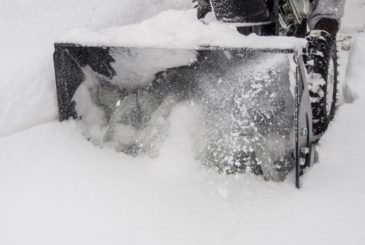 Snowblower at work on a winter day